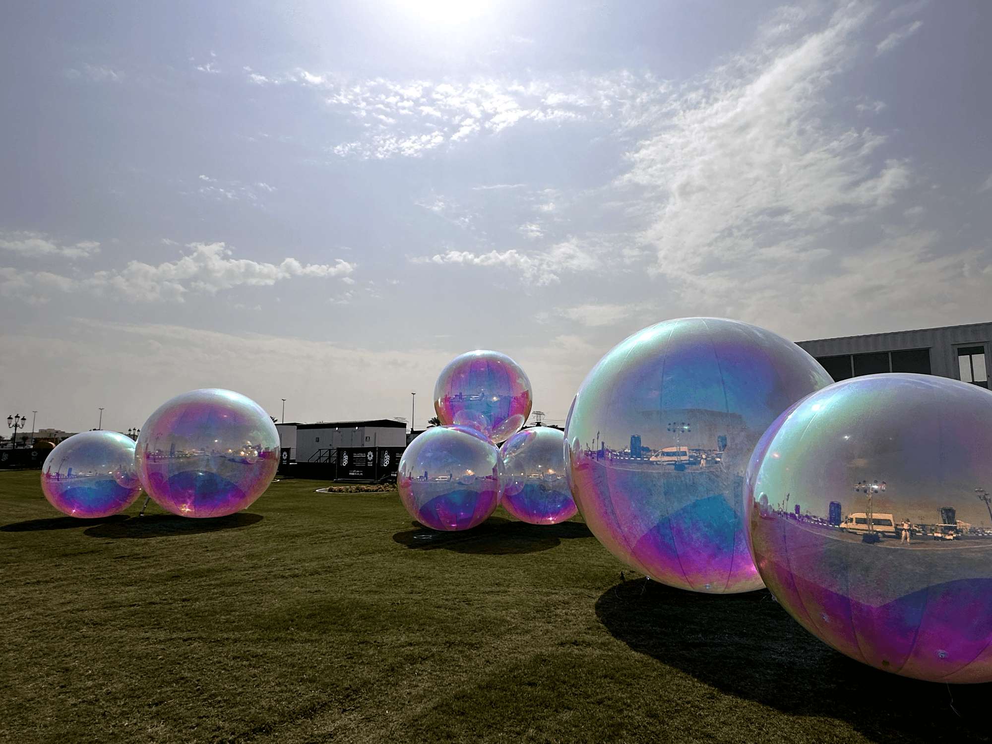 Guests exploring an illuminated giant bubble installation